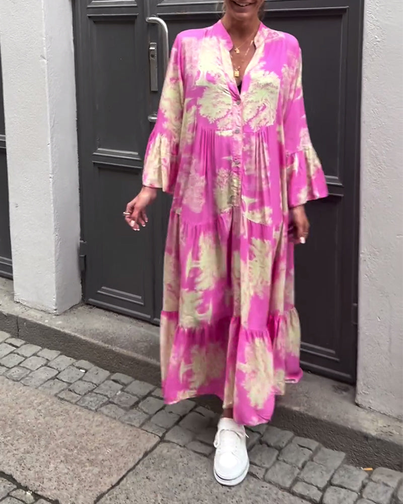 Nelina™ | Losse bedrukte jurk met v-hals en klokmouwen