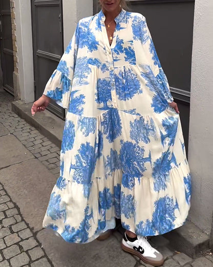Nelina™ | Losse bedrukte jurk met v-hals en klokmouwen