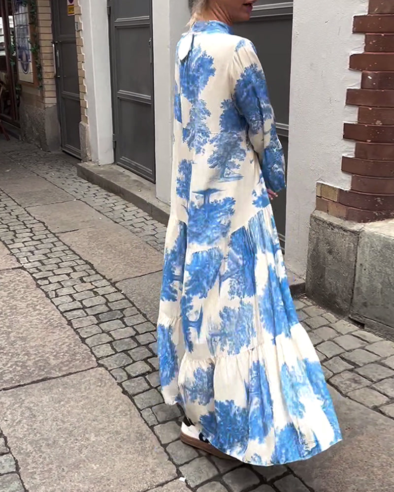 Nelina™ | Losse bedrukte jurk met v-hals en klokmouwen