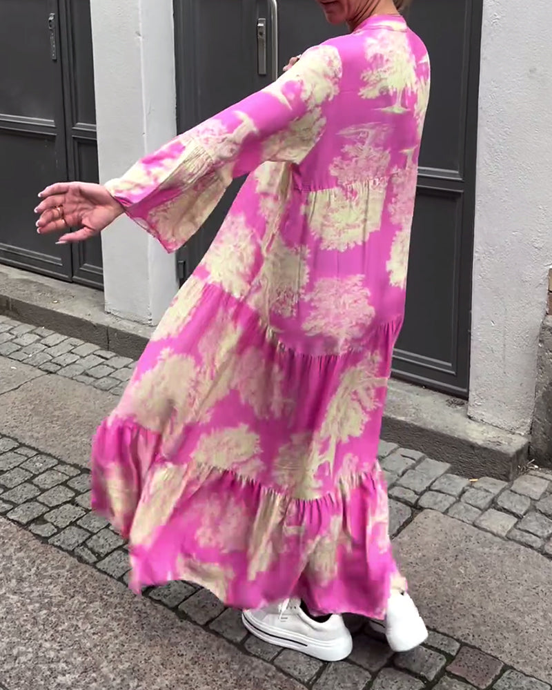 Nelina™ | Losse bedrukte jurk met v-hals en klokmouwen