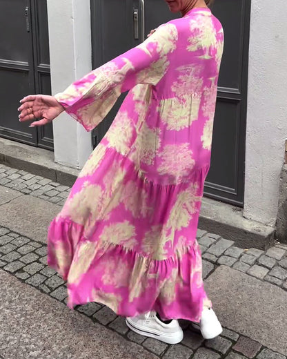 Nelina™ | Losse bedrukte jurk met v-hals en klokmouwen